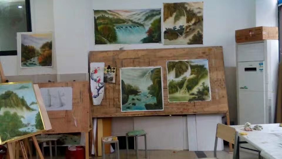 Shufeng studio interior with handmade Chinese landscape paintings in Sichuan