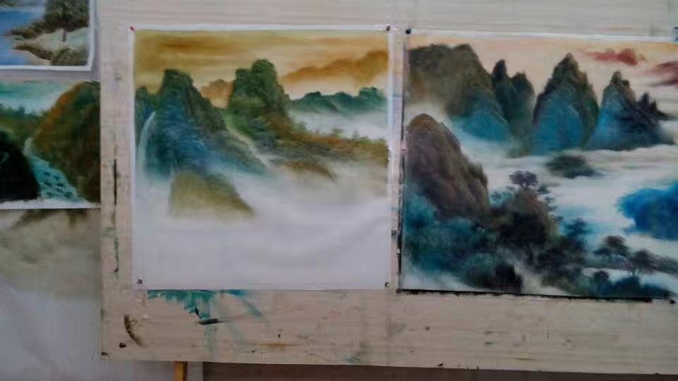 Shufeng studio interior with original paintings and easels