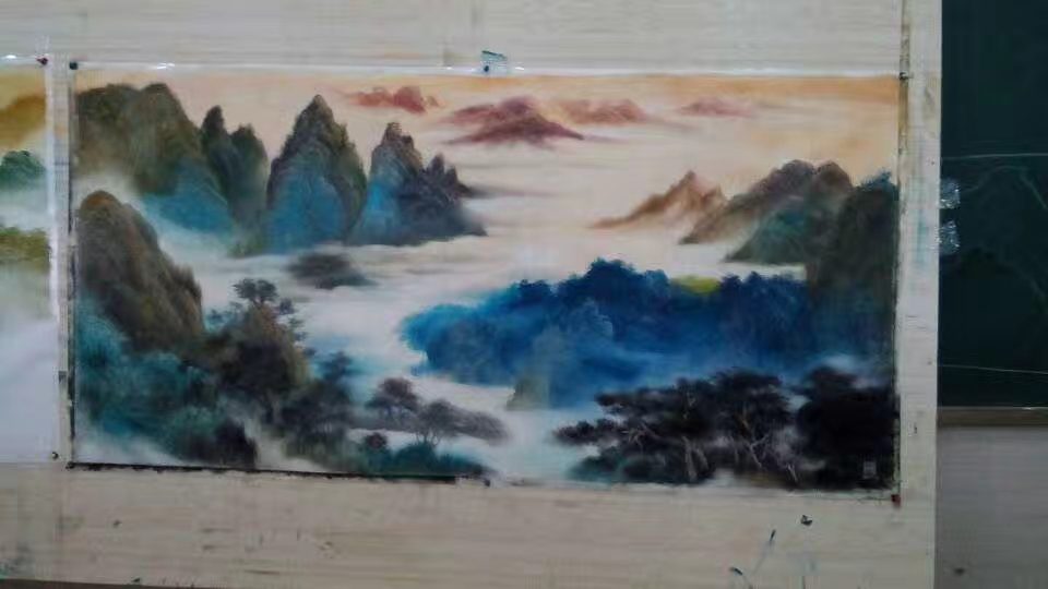 Shufeng Studio easels and landscape paintings in a working environment